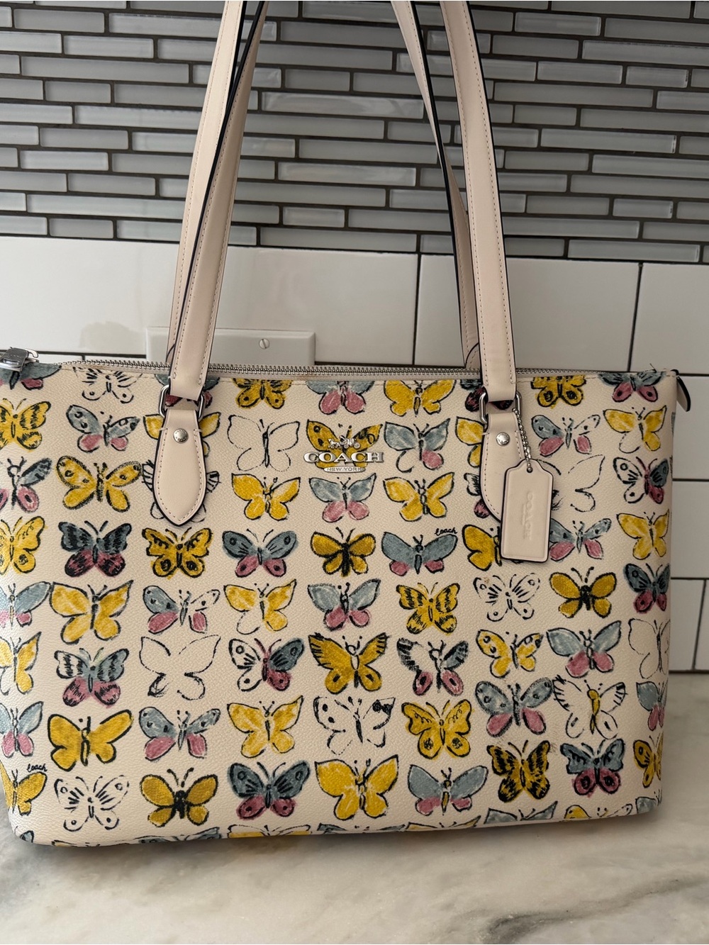 Coach Cream Tote with Yellow and Pale Pink Butterfly Print